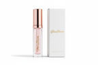 “A modern luxury cosmetic branding photo showing the GlossBloom lip oil bottle next to minimalistic packaging box with the GlossBloom logo, clean studio lighting, premium makeup brand look.”